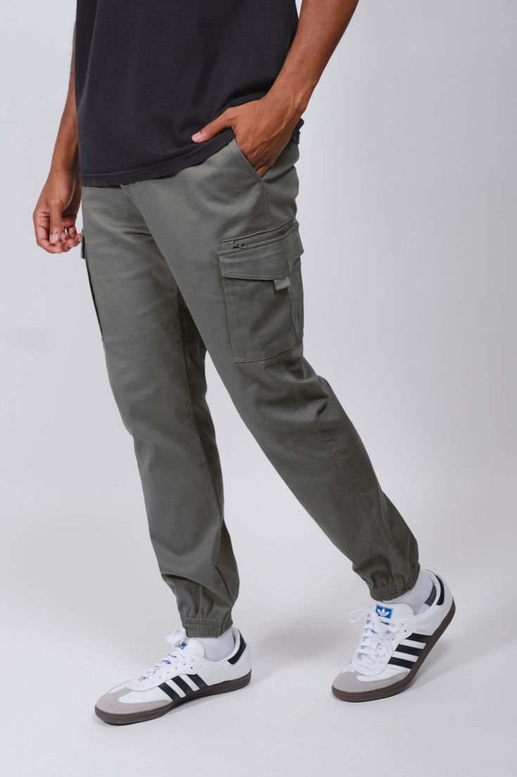 The Cargo Pocket Zip Twill Jogger will be your new favorite pants to add to your wardrobe rotation. These joggers offer both comfy and durable styles. The fit is relaxed with added zippers to the Cargo pockets. Adding extra security to your items as well as giving more of the workwear vibe. Style: BFMI064F Urban Style Cargo Pants For Jogging, Cotton Athleisure Cargo Pants, Utility Sweatpants With Hip Pockets And Tapered Leg, Casual Joggers With Functional Pockets For Jogging, Urban Joggers With Side Pockets, Athleisure Streetwear Joggers With Hip Pockets, Athleisure Joggers With Hip Pockets For Streetwear, Urban Style Sweatpants With Pockets For Jogging, Urban Sweatpants With Pockets For Jogging