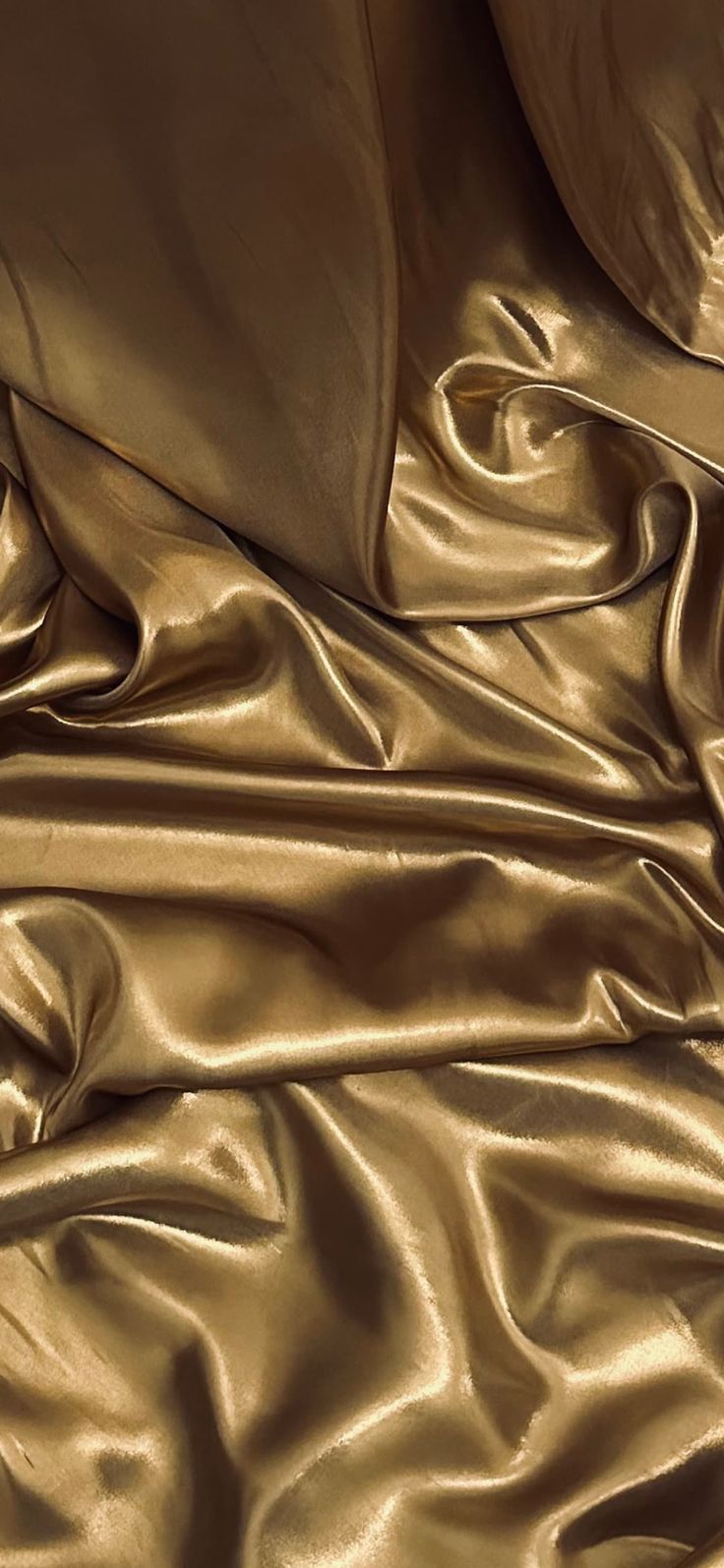 a close up view of a shiny gold cloth