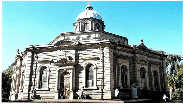 an old building with a dome on top and steps leading up to the front door