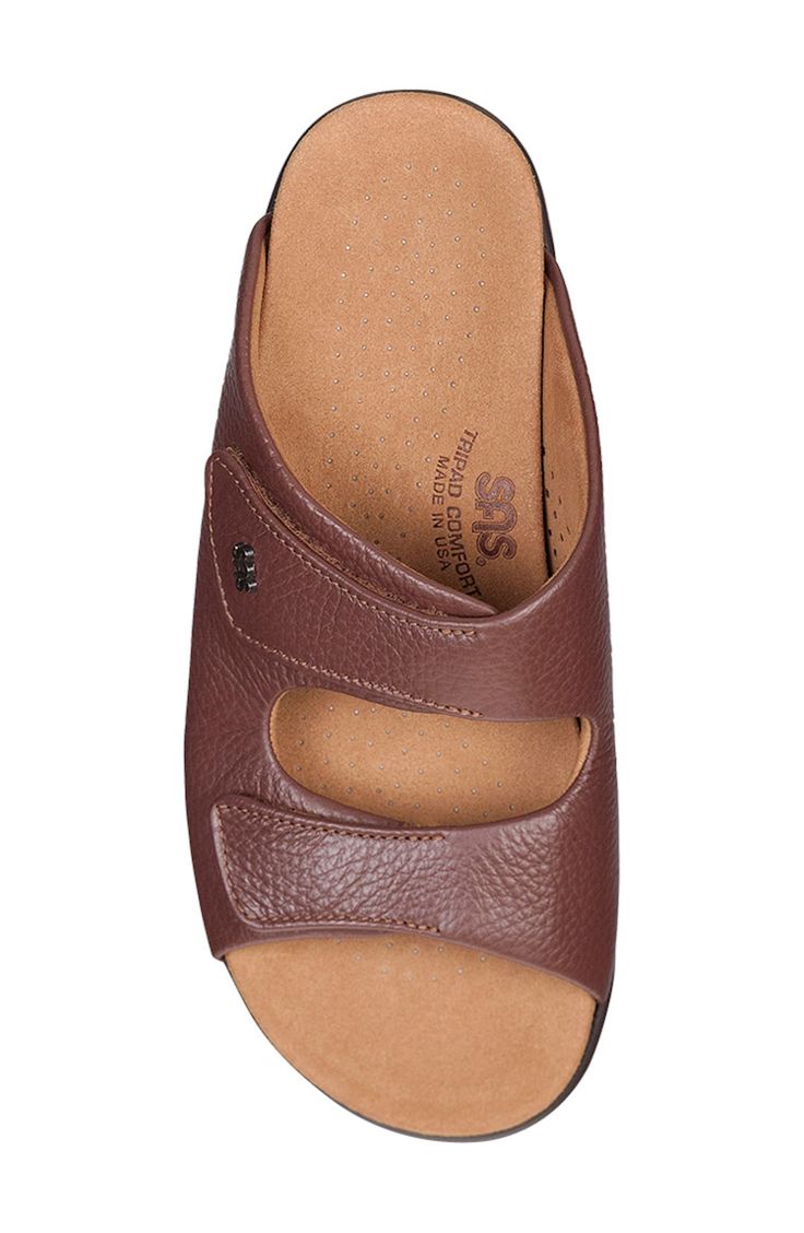 This slide sandal has an incredibly cushioned microfiber footbed that contours to the natural shape of the foot, while a comfort sole rebounds with each step. Adjustable hook-and-loop straps Cushioned footbed with arch support Shock-absorbing sole Leather upper/textile lining/synthetic sole Made in the USA Brown Slip-on Footbed Sandals With Arch Support, Brown Slides With Cushioned Footbed, Comfortable Slide Footbed Sandals With Arch Support, Comfortable Open Toe Slides With Ortholite Insole, Comfortable Open-toe Slippers With Ortholite Insole, Comfortable Ortholite Insole Open Toe Footbed Sandals, Comfortable Brown Slide Footbed Sandals, Comfortable Brown Slides With Arch Support, Comfortable Open Toe Slippers With Removable Insole