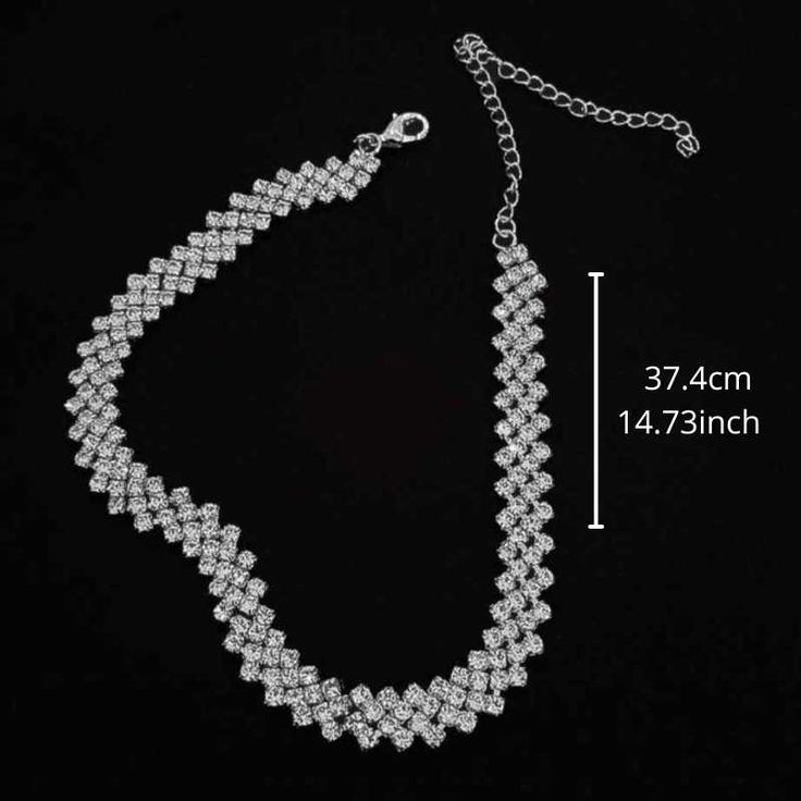 The stones are set in a precious silver-plated metal, and the necklace is designed to gracefully encircle the neck. Top layer: Electroplating for a brilliant finish Material: Silver, Alloy, Metal Sparkling Rhinestones: Full rhinestone water diamond Size: 37.4cm - *14.73inch Adjustable Size: With an extension chain of up to 10cm (3.94 inches). Hypoallergenic: Safe for sensitive skin. Gender: Female Age: Adult Brand Name: NoEnName_Null Product ID: CJLX118897201 Disclaimer: Actual colors may vary. Round Rhinestone Metal Necklace For Wedding, Round Metal Rhinestone Necklace For Wedding, Round Rhinestone Necklace For Wedding, Silver Necklace With Bling For Gift, Silver Bling Necklace For Gift, Dazzling Silver Party Choker, Silver Rhinestone Necklace In Alloy, Silver Alloy Rhinestone Necklace, Silver Diamond Rhinestone Necklace With Bling