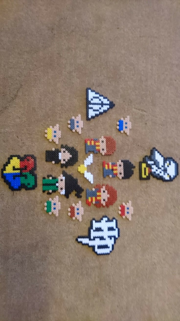 several pixelated video game characters laying on the floor next to each other with different colors and shapes