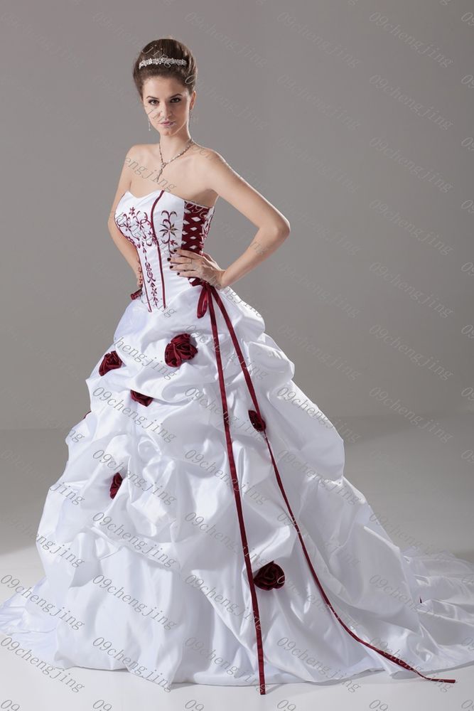 a woman in a white and red wedding dress