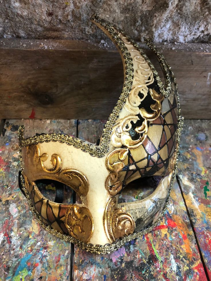 "Venetian Mask Columbine,Dove Mask,Venice mask,Carnival mask,Halloween mask,party mask,columbine mask,Venetian mask,carnival mask,carnival mask,decoration mask,dove. Original Venetian Mask Colombina, hand painted embellished with gold leaf, decoration with stucco and acrylic colors. -Material/Resin Made in Italy hypoallergenic and non-toxic. -Dimensions/15x18 Unisex -History of the mask/ \"Colombina\" is an ancient mask dating back to the 15th century. She represents a cunning and lying servant Gold Fantasy Festival Masks And Prosthetics, Artistic Masks And Prosthetics For Mardi Gras Carnival, Gold Venetian Mask For Halloween, Venetian Gold Masquerade Mask For Halloween, Gold Venetian Masquerade Mask For Halloween, Venetian Masks For Mardi Gras Carnival, Traditional Masquerade Mask For Carnival, Gold Carnival Masquerade Eye Mask, Traditional Mardi Gras Masquerade Mask