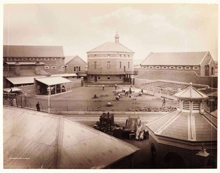 an old black and white photo of some buildings