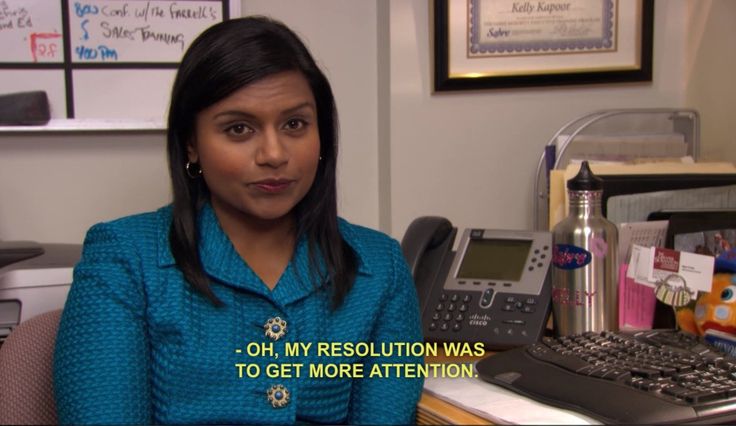 a woman sitting at a desk in an office