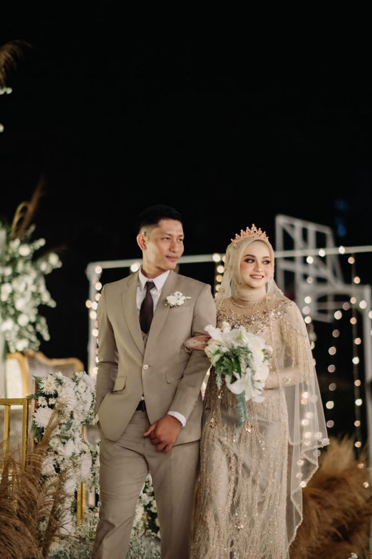 a bride and groom walking down the aisle