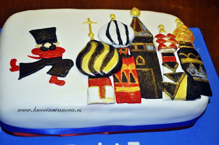 a birthday cake decorated with different types of decorations