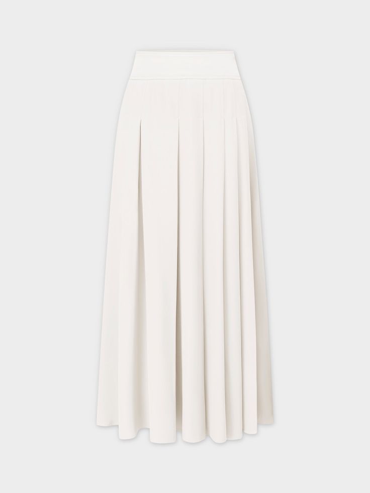 Experience effortless style with our Yolk Pleated Skirt in a classic white hue. The 37" length provides elegant coverage, while the pleated design adds texture to your look. Elegant Relaxed Skirt For Daywear, Flowy Flared Pleated Skirt For Daywear, Elegant Solid Color Maxi Skirt For Daywear, Classic Lined Skirt For Daywear, Classic Flowy Skirt, Elegant Pleated Bottoms For Daywear, Elegant Daywear Bottoms With Pleated Waist, Elegant Pleated Waist Bottoms For Daywear, Classic A-line Skirt For Daywear