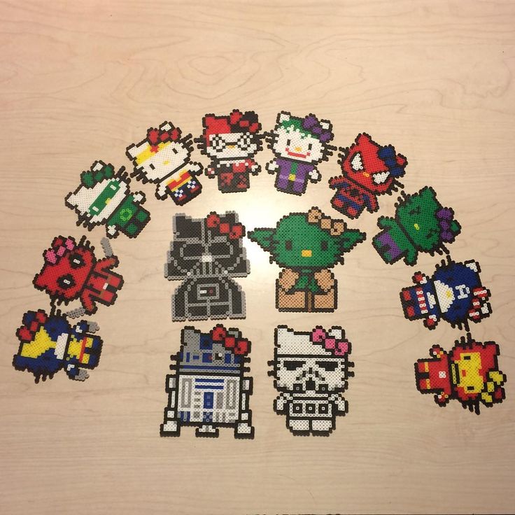 an array of pixel art on a wooden surface