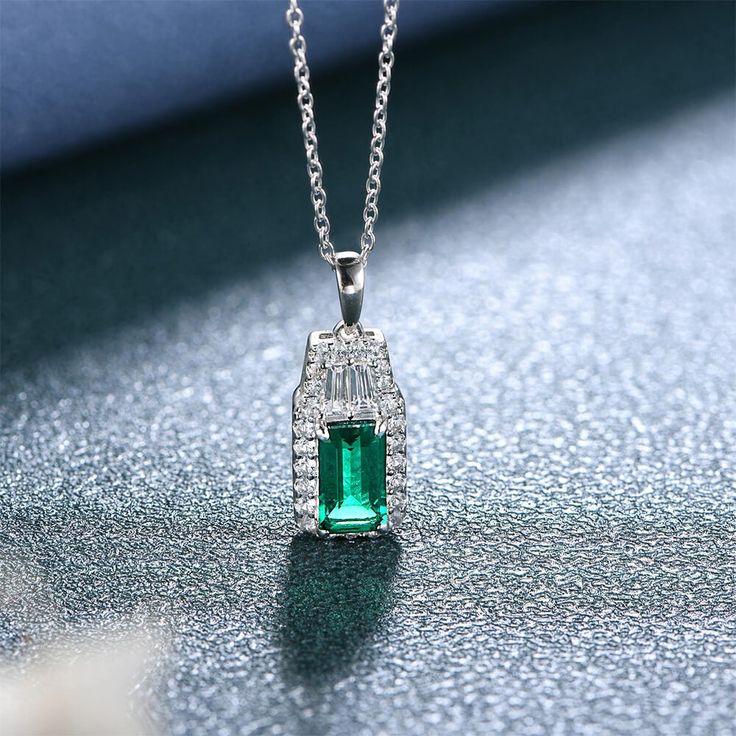 Features The lab created emerald necklace in sterling silver has a classic and luxurious design that is perfect for any occasion. Made all by hand! It truly deserves a spot in every jewelry collection. Beautifully crafted, this style is sure to become a treasured keepsake. It is made of 925 sterling silver. Made to last a lifetime, strong and durable! Strict health standards guarantee your everyday wearing. Lead-free, cadmium-free, nickel-free and allergy-free. Harmless to your health. Mirror po Sapphire Side Stones, White Lab, Lab Created Emerald, Double Halo, Emerald Necklace, Pretty Box, Stone Material, Luxurious Design, Stone Setting