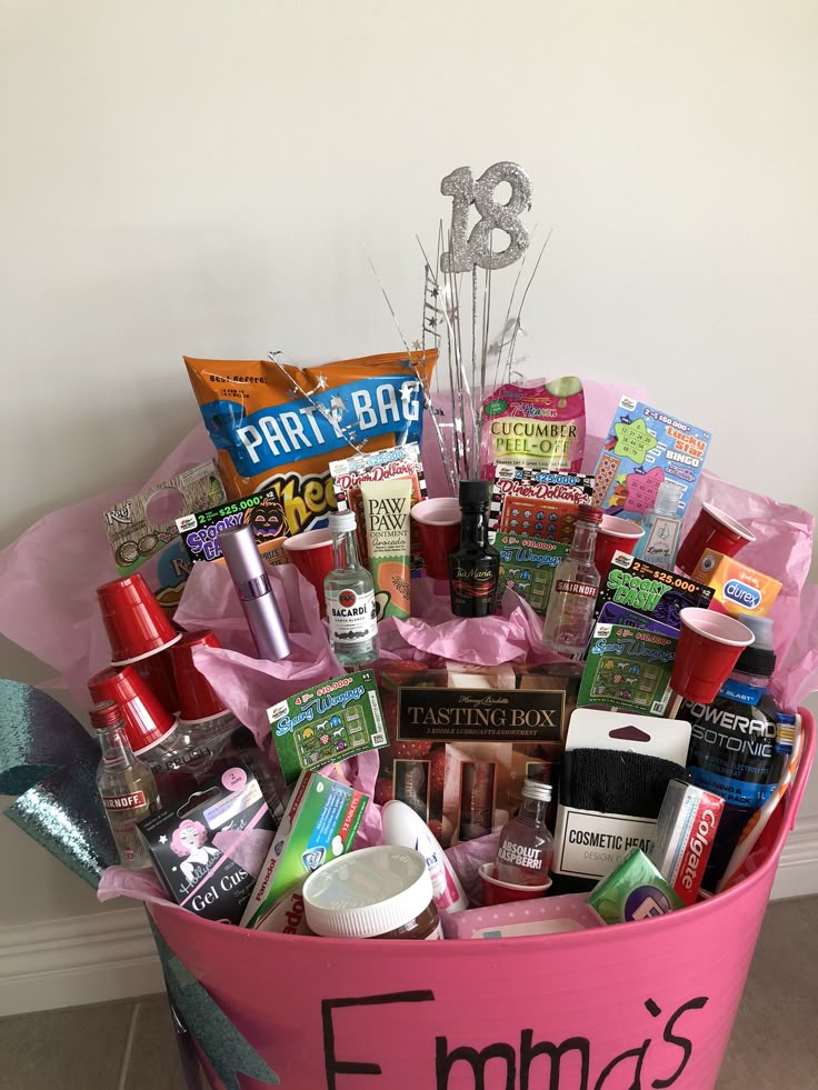 a pink bucket filled with lots of different items