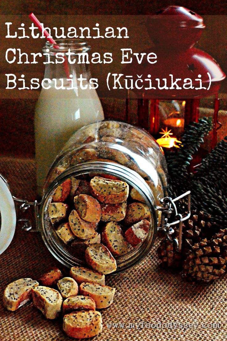 there is a jar full of biscuits next to pine cones and other holiday decorations on the table