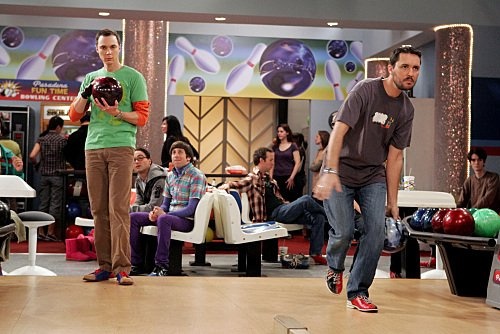 two men are playing bowling on the television show big brother's house, which is set to air