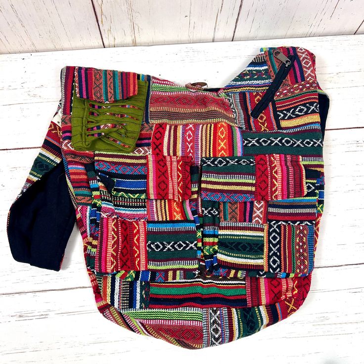 Elevate your bohemian style with our Handmade Gheri Cotton Patchwork Sling Bag, a unique and colorful accessory designed for those who appreciate artistry and functionality.Artisanal Craftsmanship: Handcrafted with care, each bag features a distinctive patchwork design using Gheri cotton, known for its durability and vibrant patterns. Multi-Pocket Design:Stay organized on the go with multiple pockets. This sling bag includes a spacious main compartment, two front pockets with Velcro closure, one Bohemian Cotton Hobo Shoulder Bag, Bohemian Cotton Bag With Adjustable Strap, Colorful Patchwork Shoulder Bag For Daily Use, Casual Green Patchwork Shoulder Bag, Casual Multicolor Patchwork Hobo Bag, Multicolor Cotton Hobo Shoulder Bag, Multicolor Patchwork Hobo Bag For Daily Use, Daily Use Multicolor Patchwork Hobo Bag, Colorful Patchwork Shoulder Bag For Everyday Use