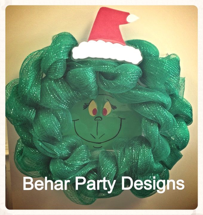 a green wreath with a red santa hat on it and the words behar party designs