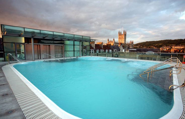 an empty swimming pool on the roof of a building