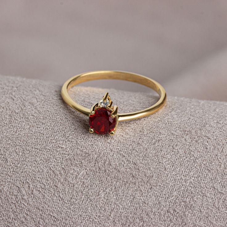 It is a stone that represents passion, true friendship, loyalty, success and consistency. It has names such as dreaming, garnet and mercy stone.. Garnet is the birthstone for those born in January. Meet the essence of elegance: Solitaire garnet ring. Handcrafted with precision, this exquisite piece features a majestic sapphire set in a magnificent design. A symbol of timeless beauty, it embodies sophistication and elegance. Elevate your style with this breathtaking masterpiece. A stylish jewel f Ruby Wedding Ring With Diamond Accents, Classic Crystal Birthstone Ring, Classic Crystal Birthstone Ring With Round Cut, Classic Crystal Ring With Birthstone In Round Cut, Fine Jewelry Birthstone Ring With Brilliant Cut Cubic Zirconia, Elegant Birthstone Ring With Diamond Accents For Wedding, Fine Jewelry Ruby Ring With Diamond Accents For Wedding, Diamond Birthstone Ring For Anniversary, Diamond White Birthstone Rings For Formal Occasions