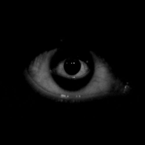 an eye is shown in the dark