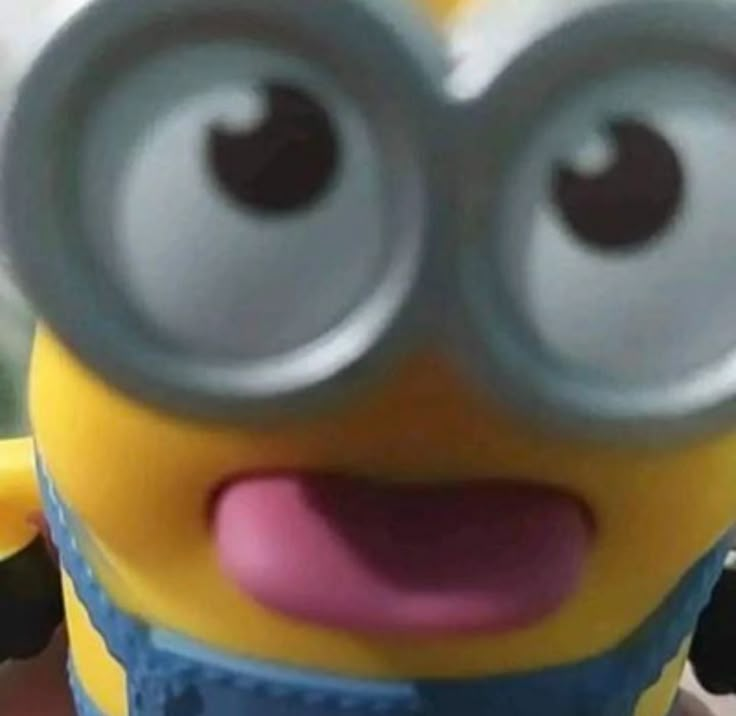 a close up of a minion with big eyes