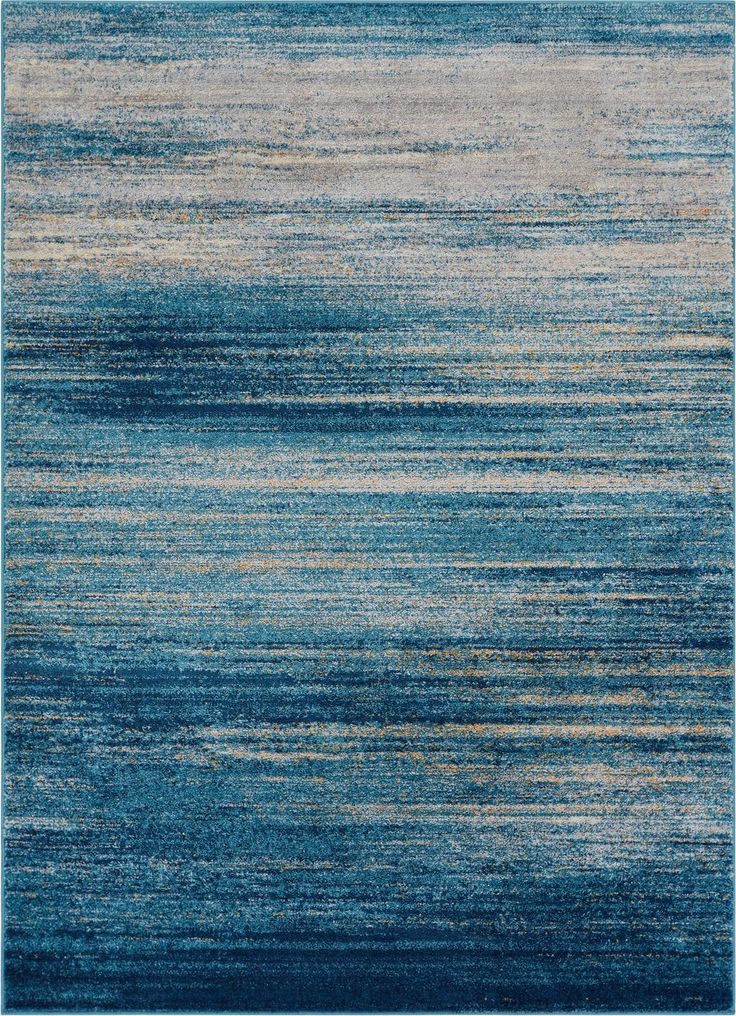 an area rug with blue and beige colors