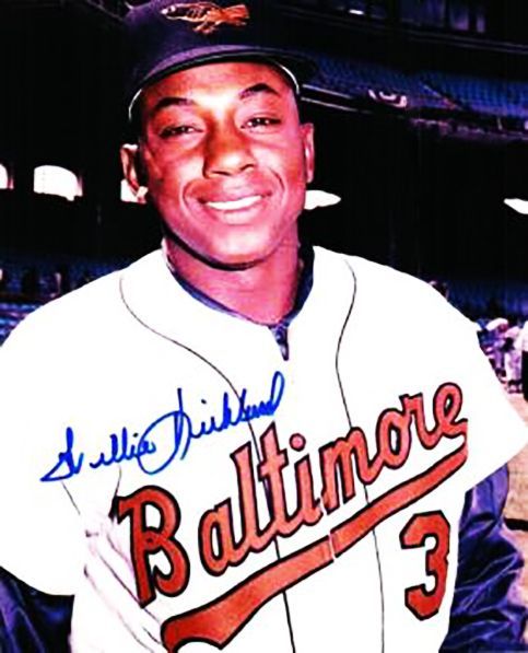 an autographed baseball player is smiling for the camera