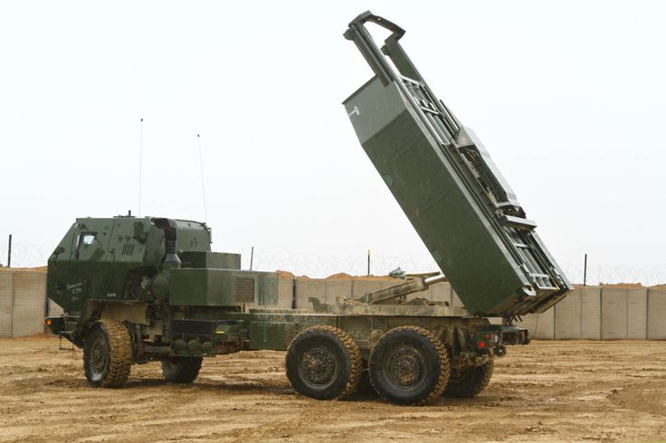 an army truck carrying a missile on top of it's back