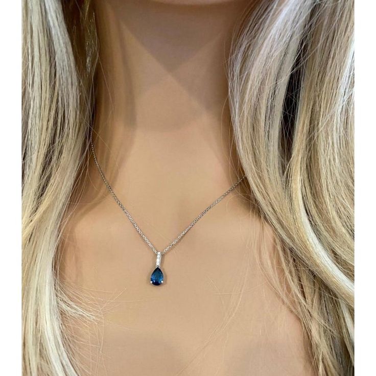 Fourteen karats white gold sapphire and diamond necklace pendant Trending style of layers on layers of gold chains to chunky, retro pendants paired with dainty chokers, layering your necklaces has become an art Necklace measuring 16 inches long Diamond bail hanging pendant 0.35" long with pear shaped sapphire drop Pear Shaped blue sapphire weighing 1.15 carats Sapphire is of royal blue hue Diamond bail weighing 0.10 carats Oval cable chain necklace with spring lock New Necklace Handmade in the USA Some gemstones are very hard to match. The gems that exude subtle color variations are very tough candidates due to color zoning, clarity, and measurements. Our collections challenge our teams in both creativity and know-how.  From the initial drawings through to stone setting and the final polis Sapphire Diamond Cut Pendant Necklaces, Sapphire Pendant Necklace With Diamond Cut, Pendant Necklace With Sapphire In Diamond Cut, White Gold Sapphire Pendant Necklace, Blue Fine Jewelry With Detachable Pendant, Sapphire Pendant With Diamond Accents, Sapphire Pendant Jewelry With Diamond Accents, Sapphire Pendant Necklace With Hallmark, Sapphire Necklaces With Diamond Accents Pendant