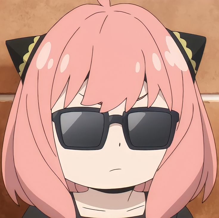 an anime character with pink hair and black sunglasses wearing cat ears, looking at the camera