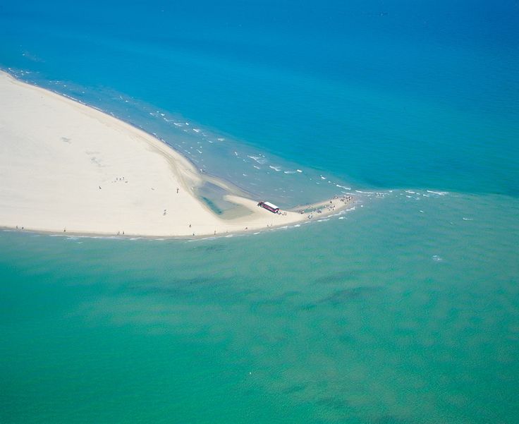 an island in the middle of some water