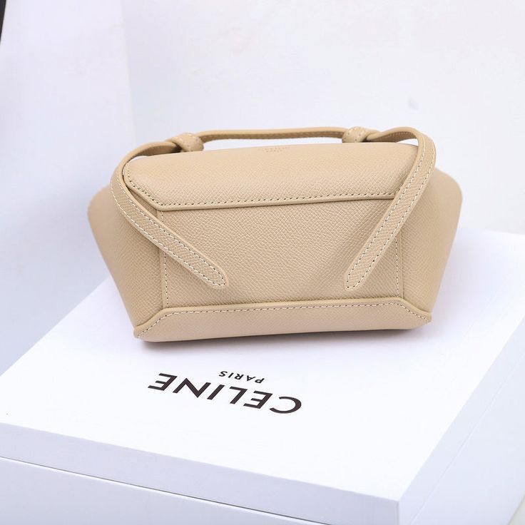 Size: 15cm*13cm*9cm It comes with Dust box, Care manual, Tag, and Paper bag. Modern Top Handle Pouch For Gift, Modern Top Handle Pouch As Gift, Modern Beige Shoulder Bag With Mobile Phone Holder, Beige Rectangular Box Bag For Mobile Phone, Beige Rectangular Box Bag For Office, Square Box Bag With Large Capacity For Gift, Detachable Handle Top Handle Bucket Bag As Gift, Top Handle Bucket Bag With Detachable Handle As Gift, Modern Cream Bag For Gift