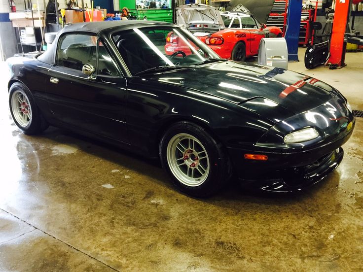 a black sports car parked in a garage