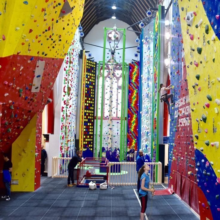 the indoor climbing gym is full of colorful walls