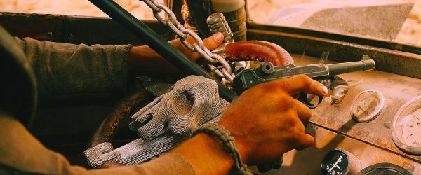 a man is working on the steering wheel of an old car with gauges and dials