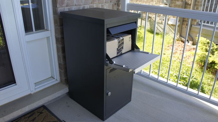 a metal filing cabinet sitting on top of a porch