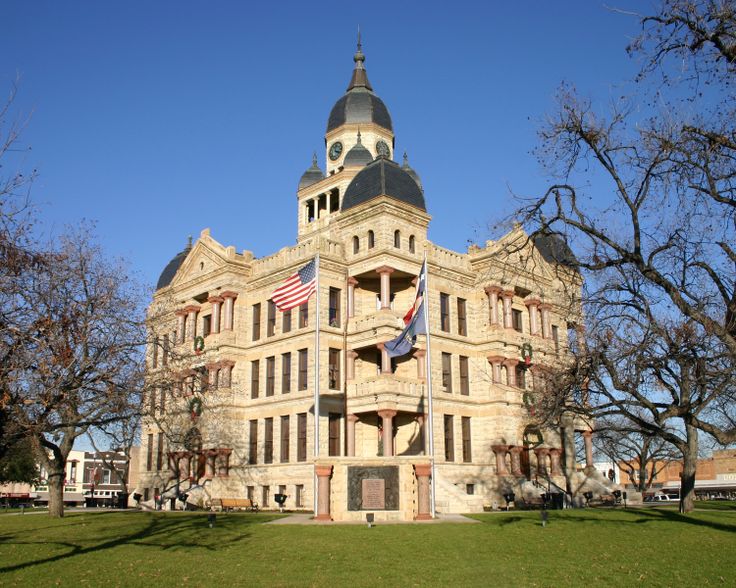 an old building with a flag on the front