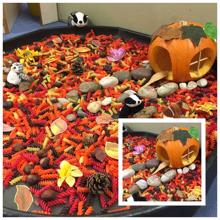 a tray filled with lots of different types of halloween decorations and fake animals on top of it