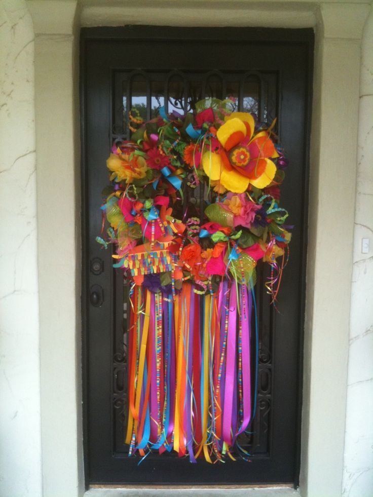 a door decorated with colorful ribbons and flowers