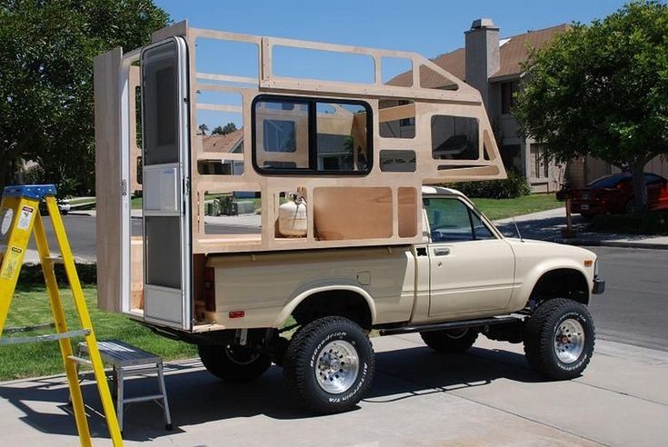 a truck with a camper attached to the back