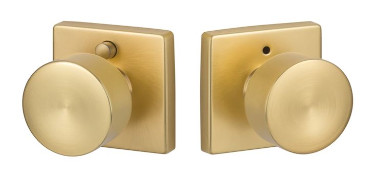 an image of two knobs on a door handle in satin brass color with white background