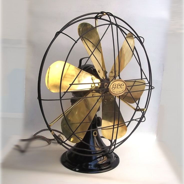 an old fashioned fan is sitting on a white surface with the word gece written on it