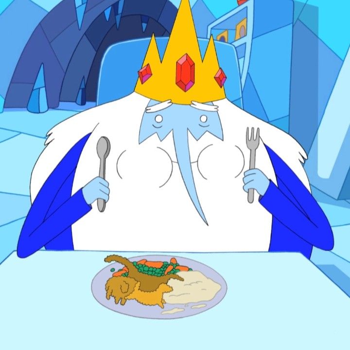 a cartoon character sitting at a table with a plate of food in front of him