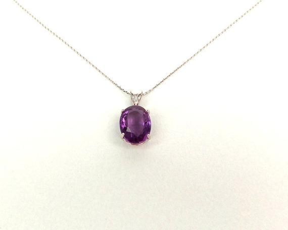 Amethyst Necklace / Sterling Silver Amethyst Pendant 4.15ct / Genuine Oval Amethyst Necklace / Purple Amethyst Necklace /February Birthstone******* FREE SHIPPING *******ANYWHERE IN THE UNITED STATESHANDMADE AND HAND SET FEBRUARY BIRTHSTONE NECKLACE 925 GENUINE AMETHYST IN A BASKET SETTING 4.15 ct.  THIS BEAUTIFUL GEMSTONE IS MEDIUM DARK PURPLE. THE NECKLACE COMES WITH A 16 OR AN 18 INCH STERLING SILVER CHAIN. PLEASE SPECIFY THE LENGTH WHEN ORDERING. METAL: STERLING SILVER 925STONES: GENUINE OVAL Classic Oval Amethyst Necklaces, Purple Oval Gemstone Necklace, Oval Lavender Gemstone Necklace, Classic Amethyst Oval Pendant Necklace, Nice Accessories, February Birthstone Necklace, Heartbeat Necklace, February Birthstone Jewelry, Amethyst Crystal Necklace