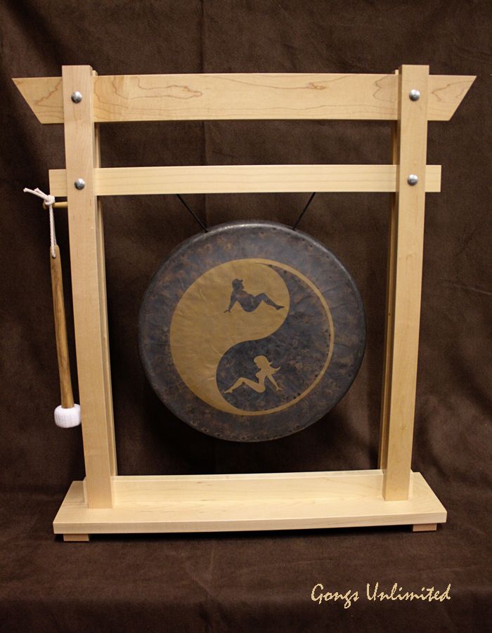 a gong sitting on top of a wooden stand