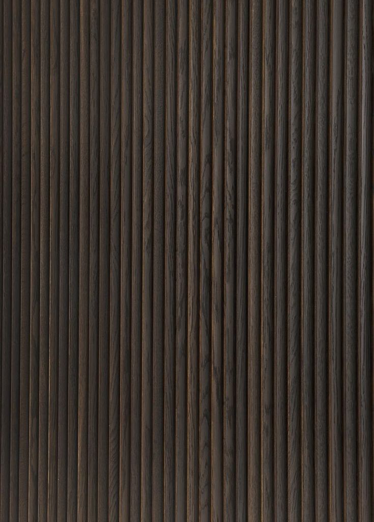 a close up view of the wood grains on an exterior wall in dark brown