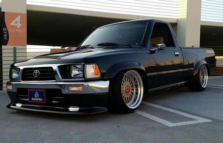 a black pickup truck parked in a parking lot