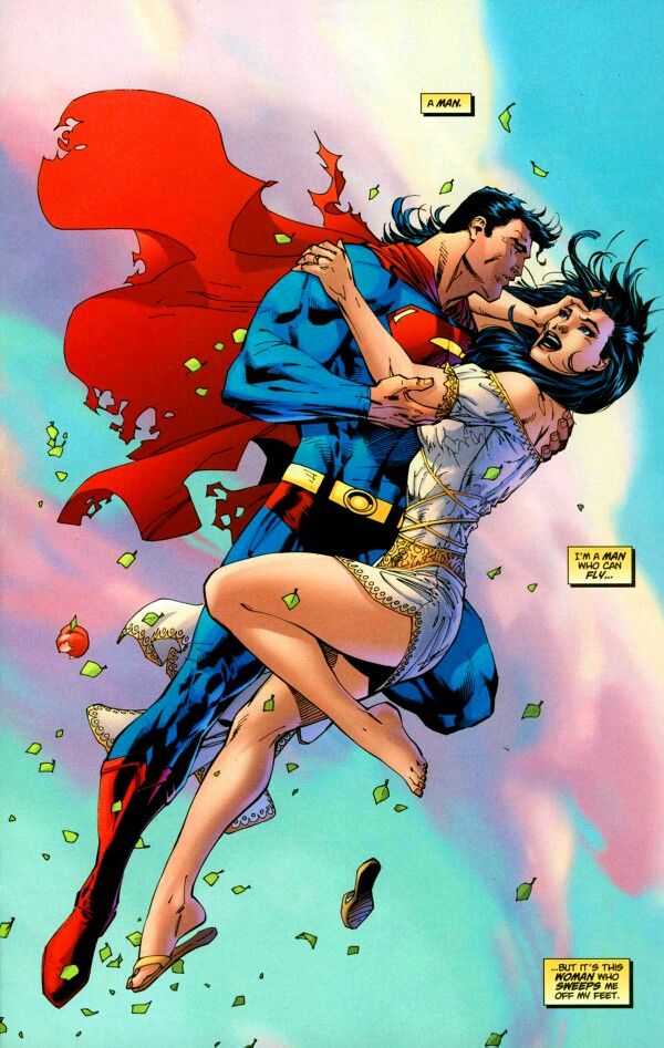 superman and wondergirl kissing in the air with their arms around each other, surrounded by confetti