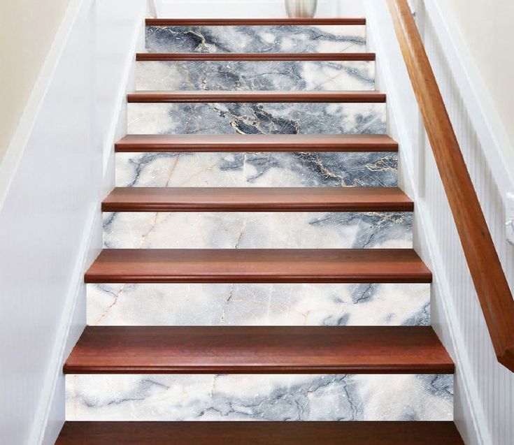 the stairs are made of wood and marble