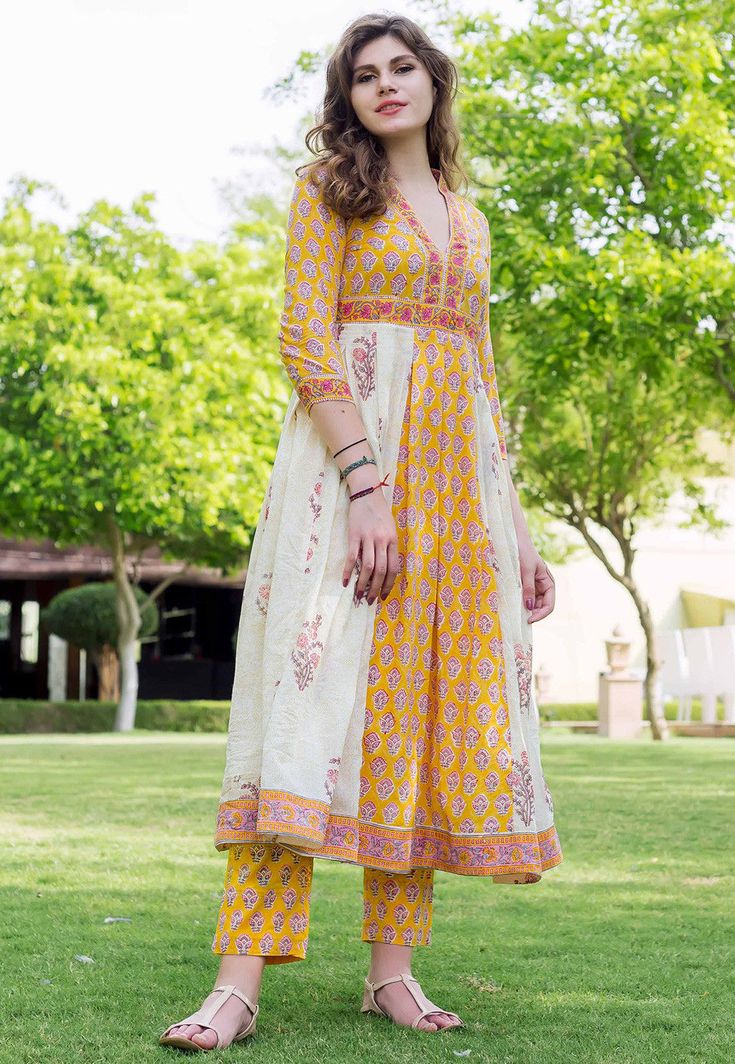 Cotton Anarkali Kurta in Yellow and White This Readymade attire is Enhanced with Hand Block Print and is Crafted in Chinese Collar Neck and Quarter Sleeve Available with a Cotton Pant in Yellow Do note: Accessories shown in the image are for presentation purposes only. (Slight variation in actual color vs. image is possible). Check Kurti Designs, Pakistani Kurti Designs, Indian Kurti Designs, New Kurti Designs, Long Kurta, Simple Kurti Designs, Salwar Designs, Long Kurti Designs, Pakistani Dresses Casual