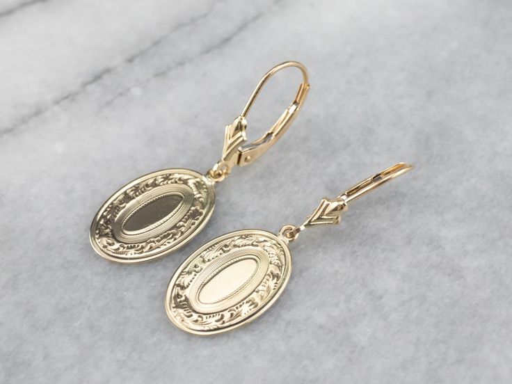 These beautiful earrings were handcrafted by our studio, using pieces of antique cufflinks! The handsome, sophisticated dangles are a beautiful yellow 14k gold that is chased with beautiful scrolling details! These date to the Victorian era! We've created bails and hung them on leverbacks of 14K yellow gold. Metal: 14K Yellow Gold Earrings Length: 32 mm Earrings Width: 11 mm Marks: “14K” Stamped on the reverse Polished Finish Drop Earrings For Wedding, Wedding Drop Earrings With Polished Finish, Antique 14k Gold Hallmarked Earrings, Vintage 14k Stamped Earrings For Formal Occasions, Vintage 14k Gold Filigree Earrings, Victorian Engraved Earrings For Formal Occasions, Antique Yellow Gold Earrings For Formal Occasions, Antique Yellow Gold Earrings For Formal Events, Formal Engraved Drop Earrings